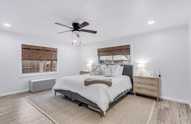 bedroom featuring ceiling fan and light wood-type flooring