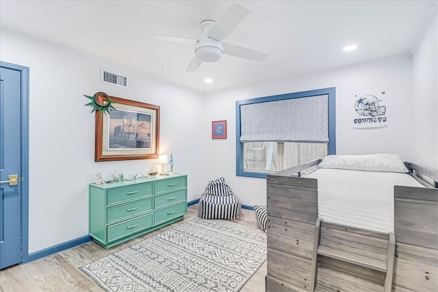 bedroom with ceiling fan and light wood-type flooring