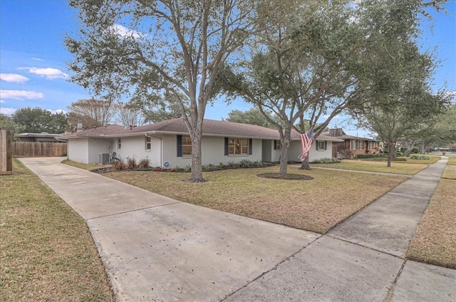 single story home with a front lawn