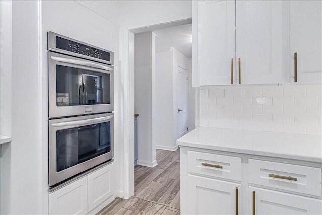 kitchen with white cabinets and stainless steel double oven