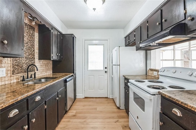 kitchen featuring white electric stove, under cabinet range hood, a sink, stainless steel dishwasher, and light wood finished floors