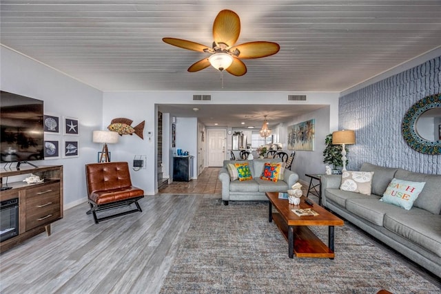 living room featuring hardwood / wood-style flooring and ceiling fan