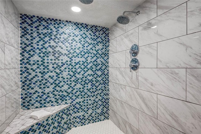 bathroom featuring tiled shower