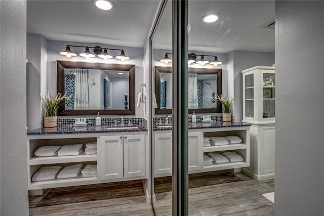 bathroom featuring hardwood / wood-style flooring and vanity