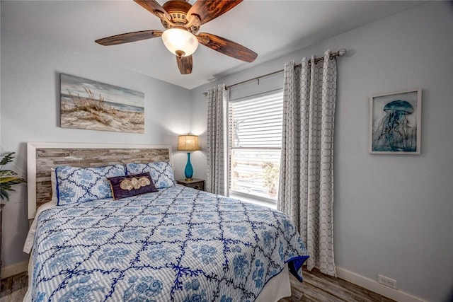 bedroom featuring hardwood / wood-style flooring and ceiling fan