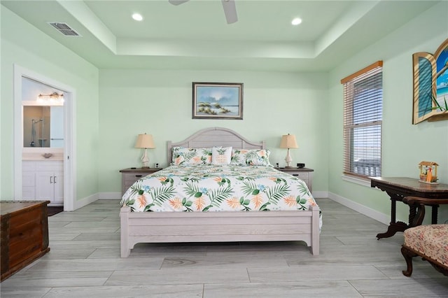 108 Bayshore Drive, Ingleside On The Bay, TX 78362 - bedroom with a tray ceiling, wood tiled floors, baseboards, and recessed lighting