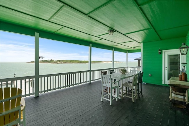 108 Bayshore Drive, Ingleside On The Bay, TX 78362 - wooden deck with a water view and outdoor dining space