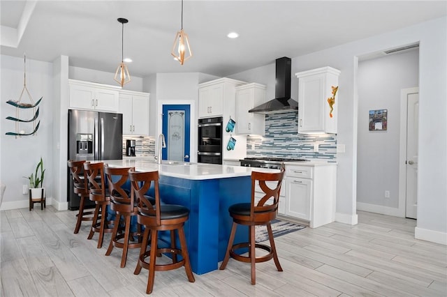 108 Bayshore Drive, Ingleside On The Bay, TX 78362 - kitchen featuring wall chimney range hood, appliances with stainless steel finishes, a sink, light countertops, and tasteful backsplash