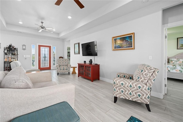 108 Bayshore Drive, Ingleside On The Bay, TX 78362 - living area with baseboards, a ceiling fan, recessed lighting, light wood-style flooring, and a raised ceiling