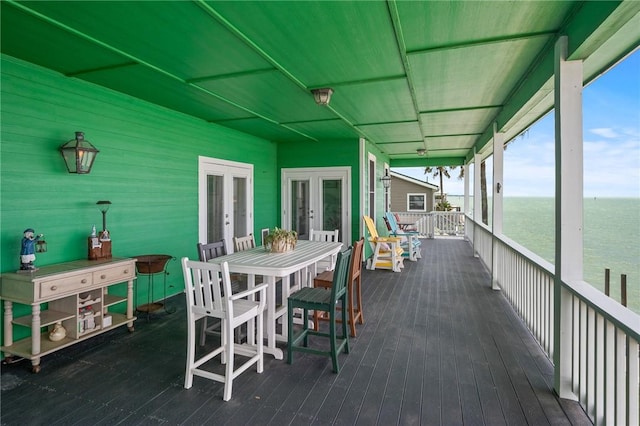 108 Bayshore Drive, Ingleside On The Bay, TX 78362 - sunroom / solarium with french doors, a water view, and outdoor dining space