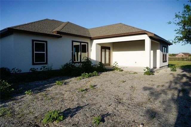 3525 Sahar Lk, Corpus Christi, TX 78380 - back of house featuring roof with shingles and stucco siding
