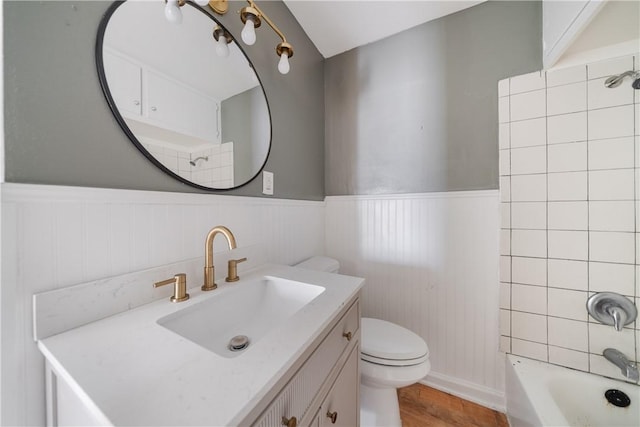 full bathroom with toilet, bathtub / shower combination, wood-type flooring, and vanity