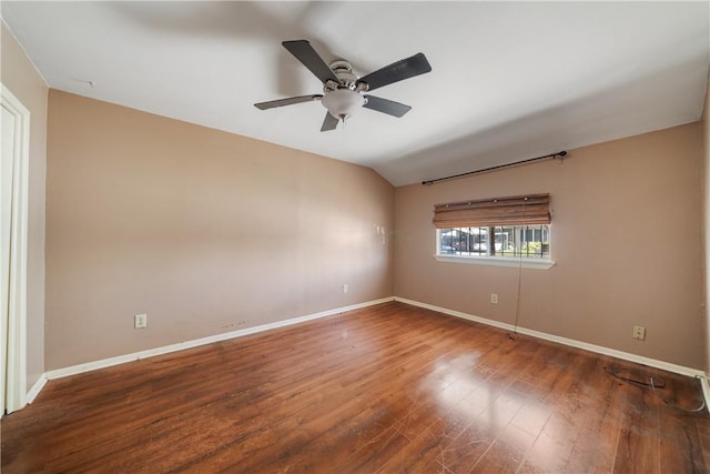 unfurnished room with ceiling fan, lofted ceiling, and hardwood / wood-style flooring