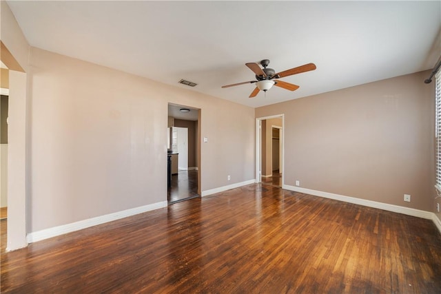 unfurnished room featuring ceiling fan and dark hardwood / wood-style flooring