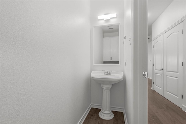 13901 Mingo Cay Ct Unit F, Corpus Christi, TX 78418 - bathroom with wood finished floors and baseboards
