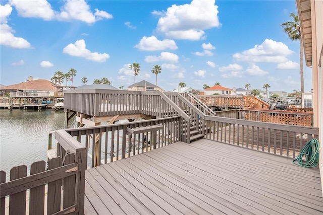 13901 Mingo Cay Ct Unit F, Corpus Christi, TX 78418 - wooden terrace featuring stairway, a water view, and a residential view