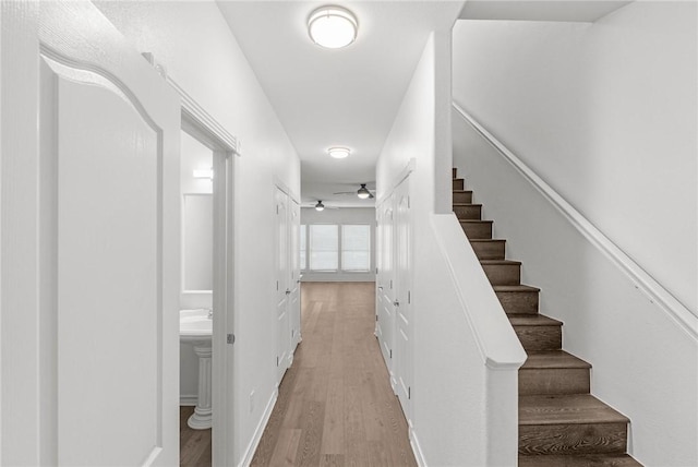 13901 Mingo Cay Ct Unit F, Corpus Christi, TX 78418 - stairs featuring wood finished floors, a ceiling fan, and baseboards