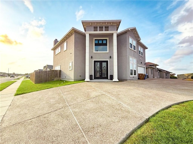 8137 Berenstain Dr, Corpus Christi, TX 78414 - view of front of home featuring french doors, fence, and stucco siding