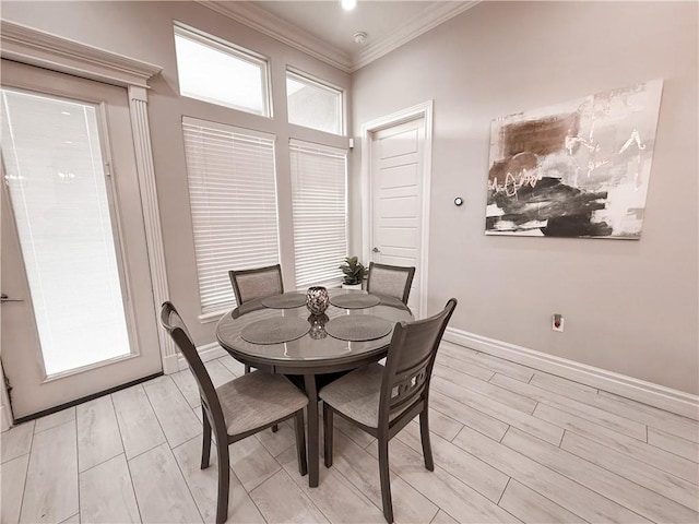 8137 Berenstain Dr, Corpus Christi, TX 78414 - dining space with baseboards, wood tiled floors, and ornamental molding