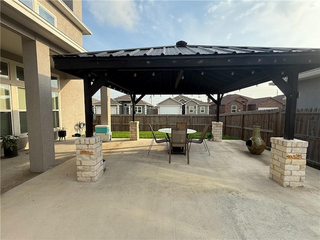 8137 Berenstain Dr, Corpus Christi, TX 78414 - view of patio / terrace with a gazebo, fence, and outdoor dining area