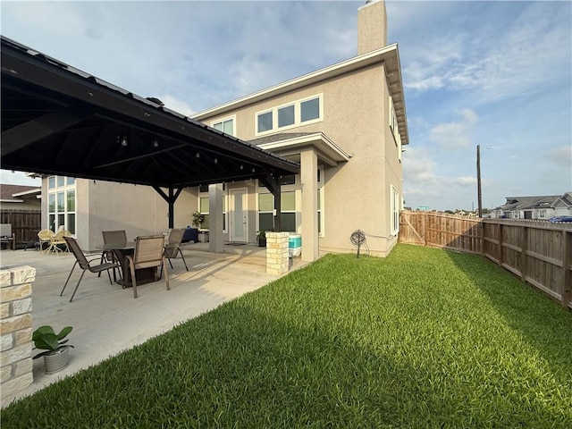 8137 Berenstain Dr, Corpus Christi, TX 78414 - rear view of property with a gazebo, stucco siding, a patio, and a chimney