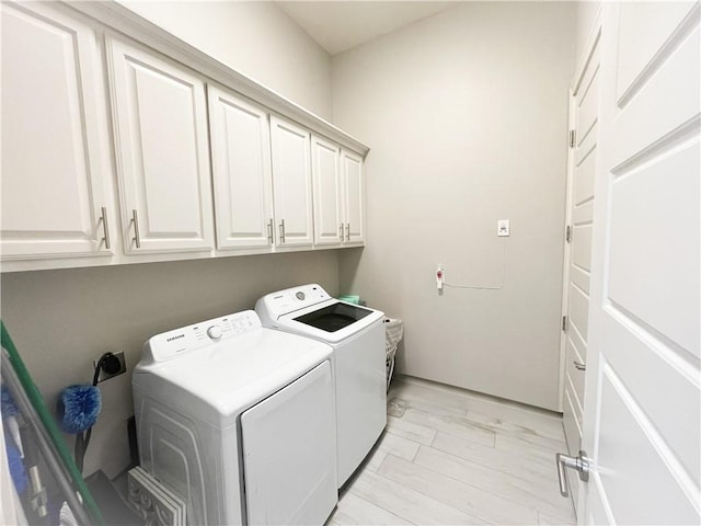 8137 Berenstain Dr, Corpus Christi, TX 78414 - laundry area with cabinet space, independent washer and dryer, and light marble finish flooring