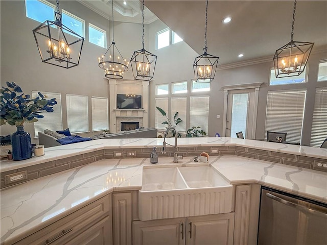 8137 Berenstain Dr, Corpus Christi, TX 78414 - kitchen with dishwasher, a sink, a chandelier, crown molding, and open floor plan