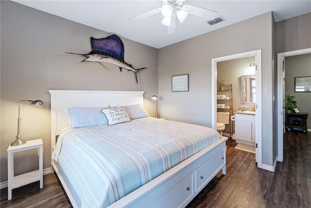 bedroom featuring connected bathroom, dark wood-style flooring, a ceiling fan, visible vents, and baseboards