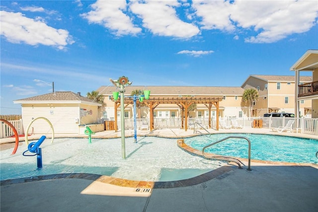 community pool with a patio and fence