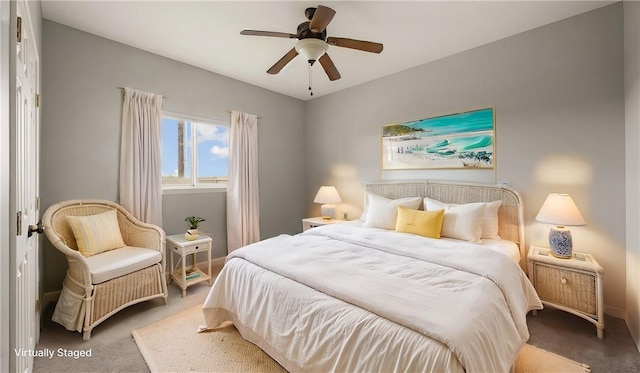 carpeted bedroom with a ceiling fan