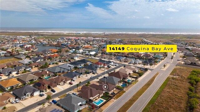 bird's eye view featuring a residential view and a water view