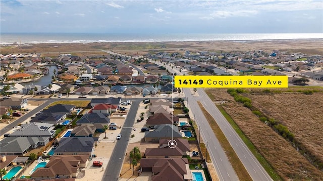 bird's eye view with a water view and a residential view