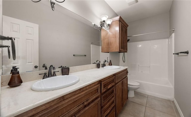 14149 Coquina Bay Ave, Corpus Christi, TX 78418 - full bathroom featuring double vanity, toilet, tile patterned floors, shower / bath combination, and baseboards