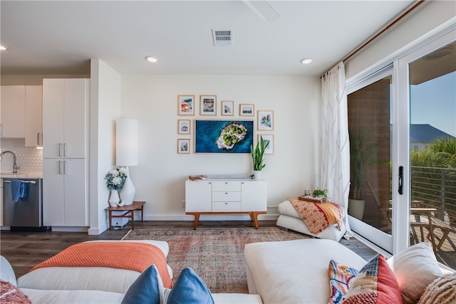 living room with dark hardwood / wood-style floors and plenty of natural light