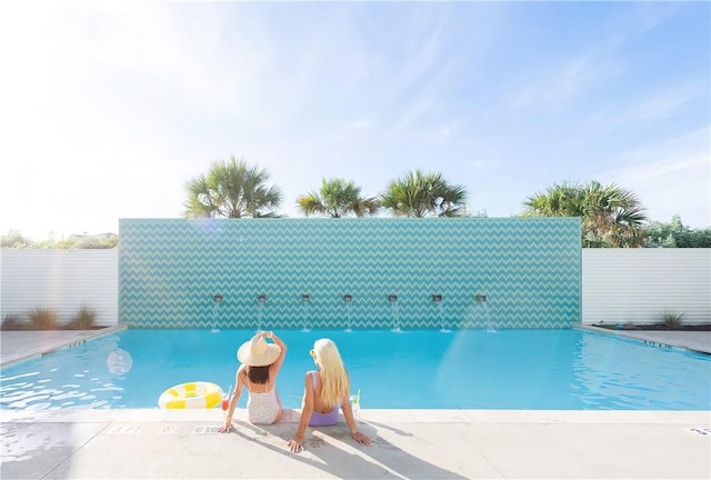 community pool with fence