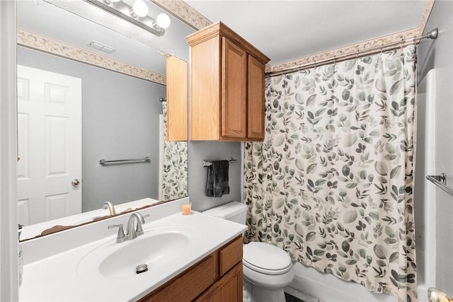 full bathroom featuring shower / bathtub combination with curtain, vanity, and toilet