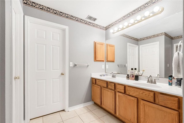 bathroom with vanity and tile patterned flooring