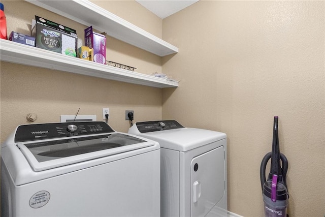 laundry room with washing machine and clothes dryer