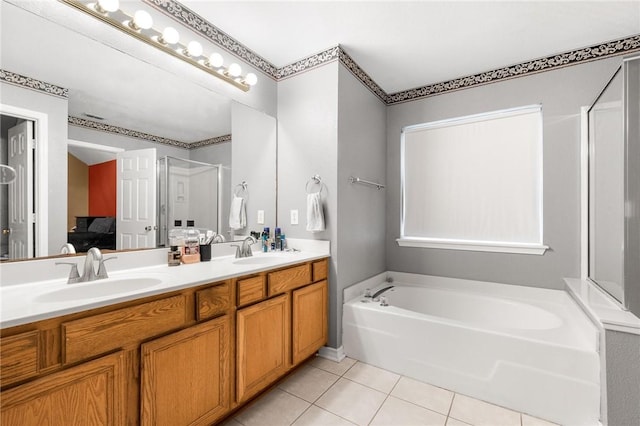 bathroom featuring tile patterned flooring, vanity, and independent shower and bath