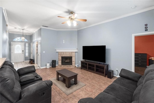 tiled living room featuring ornamental molding and ceiling fan