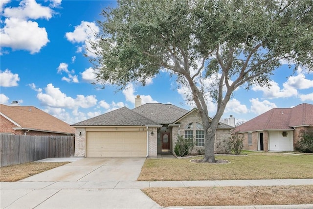 ranch-style home with a garage and a front lawn