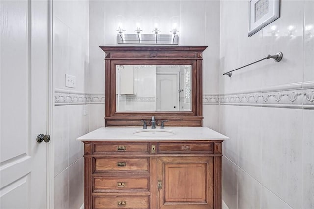 209 Jackson Pl, Corpus Christi, TX 78411 - bathroom with vanity and tile walls