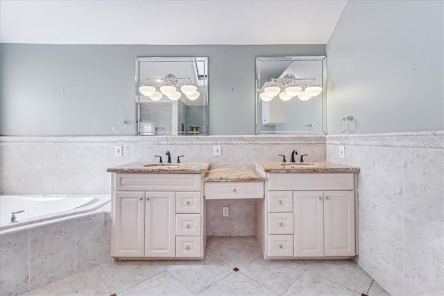 209 Jackson Pl, Corpus Christi, TX 78411 - full bathroom with tile walls, double vanity, tile patterned floors, a bath, and wainscoting