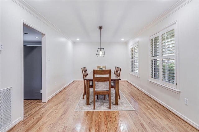 209 Jackson Pl, Corpus Christi, TX 78411 - dining room with ornamental molding, light wood-style flooring, and recessed lighting