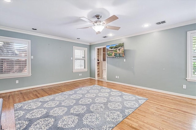 209 Jackson Pl, Corpus Christi, TX 78411 - spare room with crown molding, wood finished floors, a ceiling fan, and recessed lighting