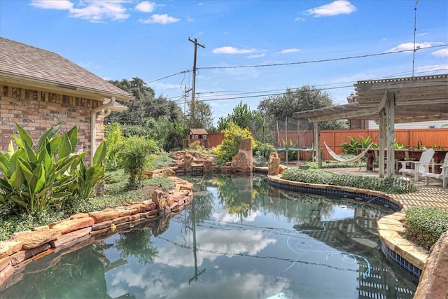 209 Jackson Pl, Corpus Christi, TX 78411 - view of swimming pool with a small pond and a patio area