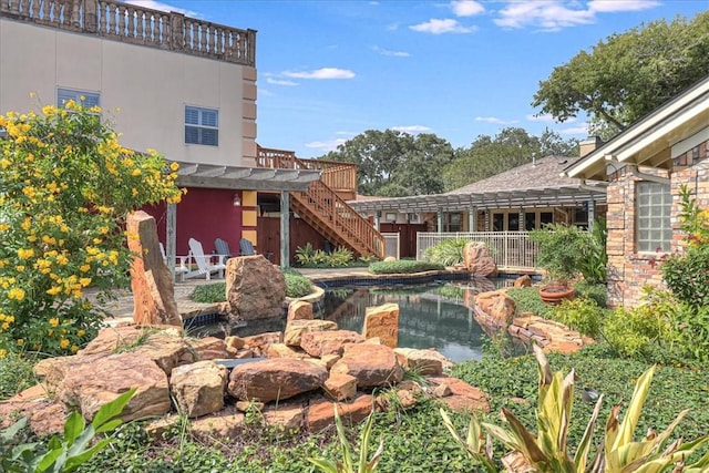 209 Jackson Pl, Corpus Christi, TX 78411 - view of yard featuring a small pond and stairs
