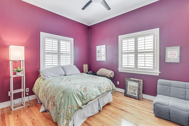 209 Jackson Pl, Corpus Christi, TX 78411 - bedroom featuring wood finished floors, multiple windows, crown molding, and ceiling fan