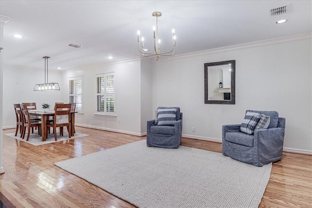 209 Jackson Pl, Corpus Christi, TX 78411 - living area featuring a chandelier, crown molding, light wood-style floors, and recessed lighting