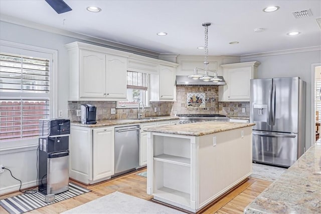 209 Jackson Pl, Corpus Christi, TX 78411 - kitchen with appliances with stainless steel finishes, light wood finished floors, white cabinetry, open shelves, and ornamental molding